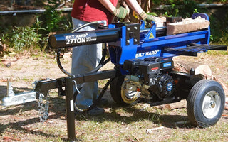 Hydraulic log splitter operating in outdoor wood cutting
