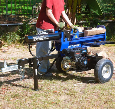 Hydraulic log splitter operating in outdoor wood cutting