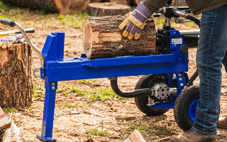 Electric log splitter preparing wood for better firewood heat output