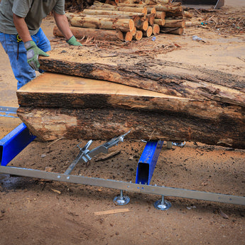 BILT HARD portable sawmill cutting logs