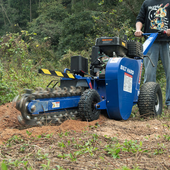 BILT HARD walk-behind trencher cutting soil outdoors