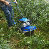 BILT HARD walk-behind brush mower clearing dense vegetation