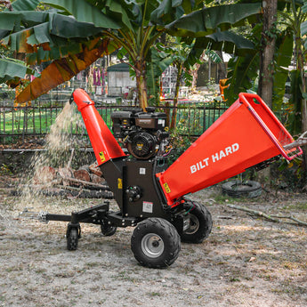 BILT HARD towable wood chipper shredding branches outdoors