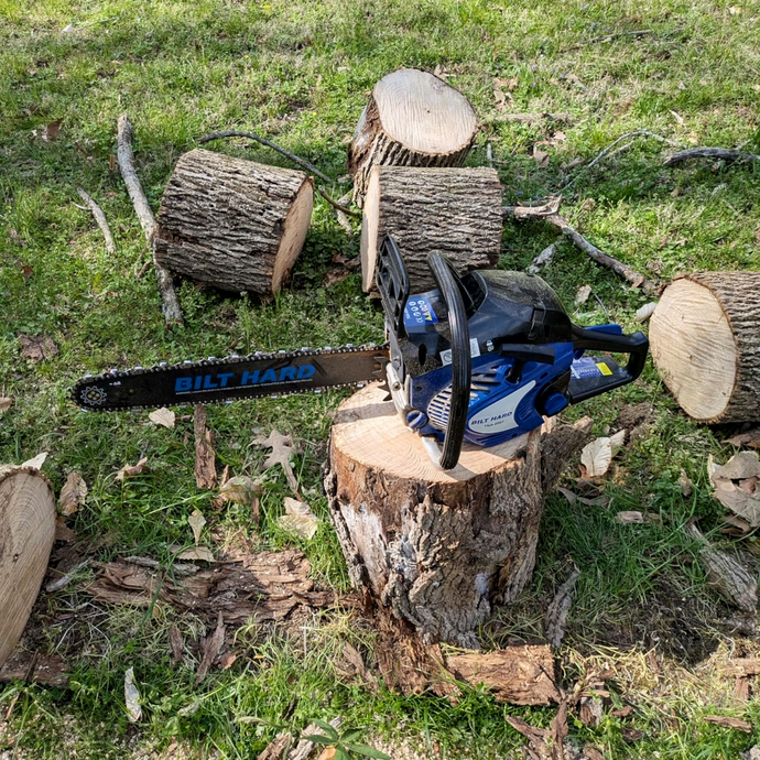 BILT HARD gas chainsaw cutting logs