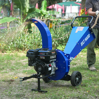 BILT HARD towable wood chipper shredding branches outdoors
