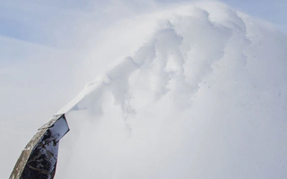 Effortless Snow Clearing: The Power of a Hydraulic Chute on Your Tractor
