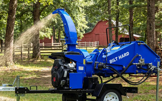 BILT HARD wood chipper clearing branches outdoors