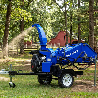 BILT HARD wood chipper clearing branches outdoors