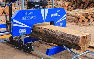 Bilthard portable sawmill making a flat cut on log