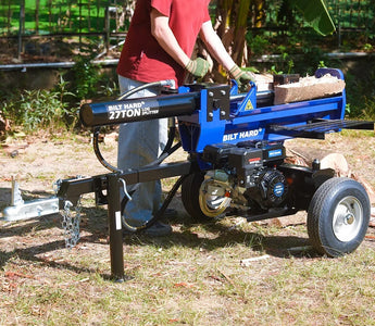 Hydraulic log splitter operating in outdoor wood cutting