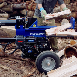 BILT HARD log splitter operator removing freshly split firewood