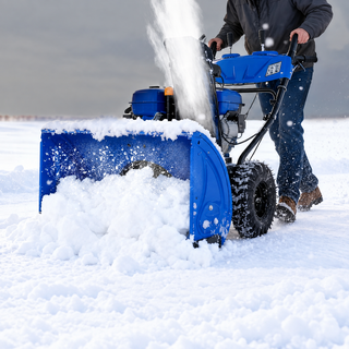 Gas snow blower removing deep snow outdoors