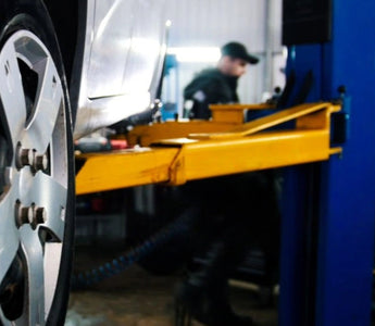 Understanding the Double-Point Lock Release System in Vehicle Lifts