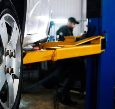 Understanding the Double-Point Lock Release System in Vehicle Lifts