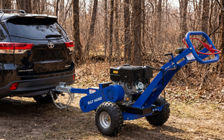 Towable wood chipper for small farm property cleanup