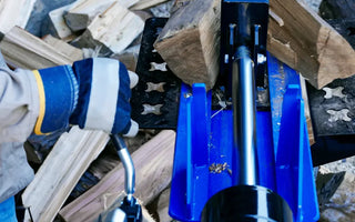 Hydraulic splitter making smaller wood pieces to keep a fire burning
