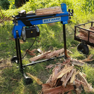Split firewood beside log splitter ready to season outdoors