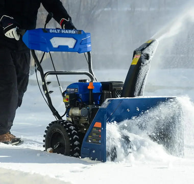 BILT HARD snow blower clearing deep snow from driveway