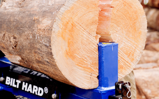 22-ton log splitter processing firewood for fire pit use
