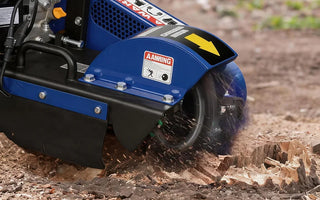 stump grinder removing tree stump outdoors