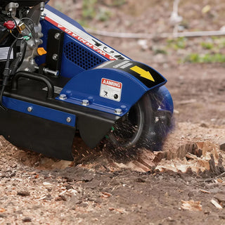 stump grinder removing tree stump outdoors